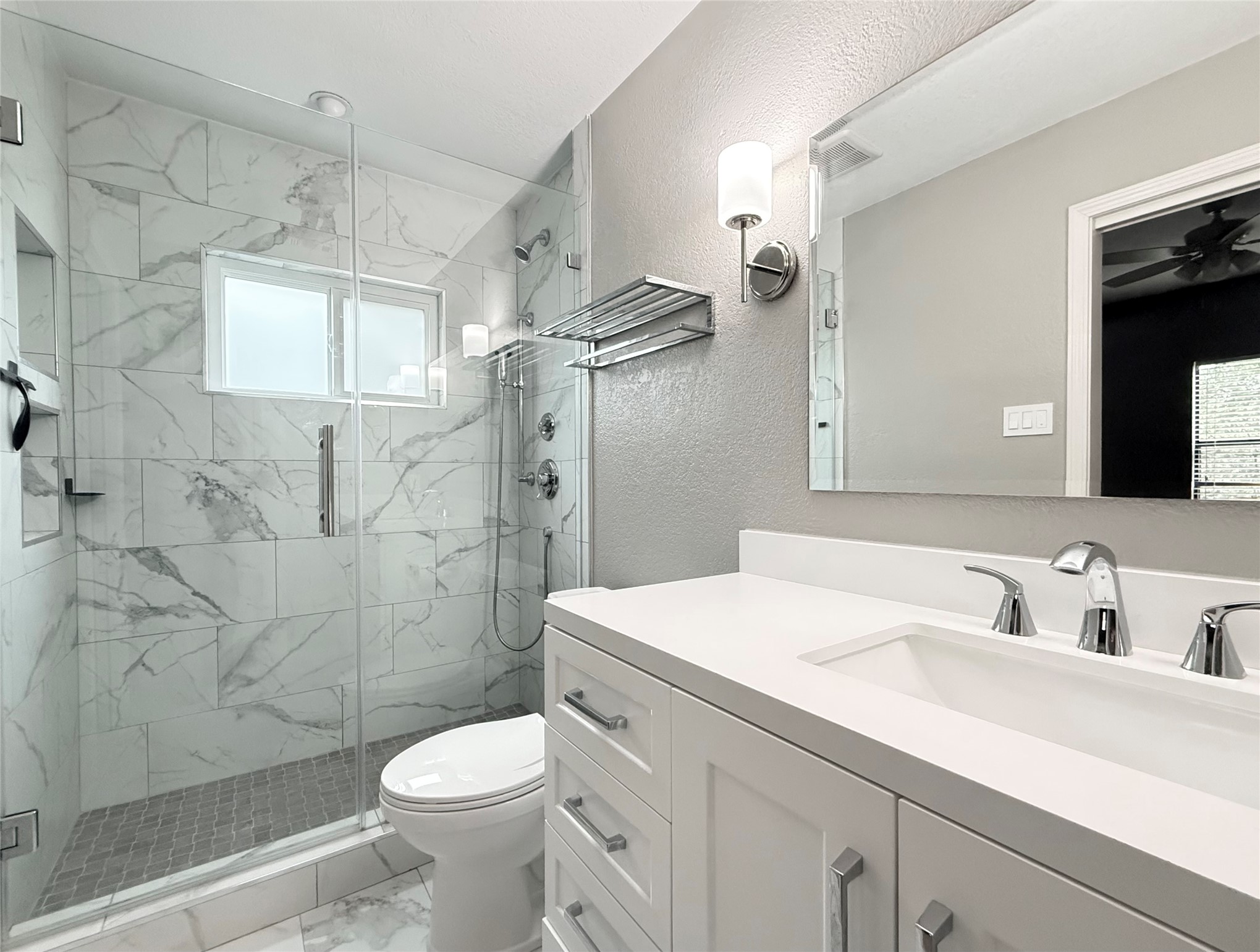 4711 Spicewood Springs Road, Unit 1201 Austin, TX 78759 - Photo 20 of 35 Updated primary bath with dual vanity and glass shower, and new window