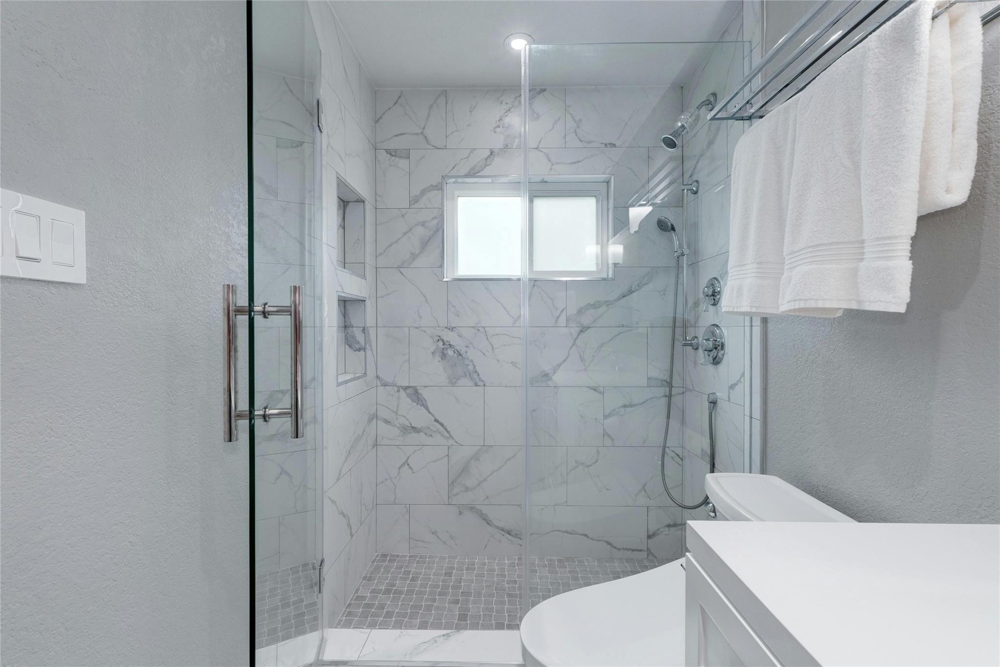 4711 Spicewood Springs Road, Unit 1201 Austin, TX 78759 - Photo 21 of 35 Primary bath with stylish finishes and walk-in shower