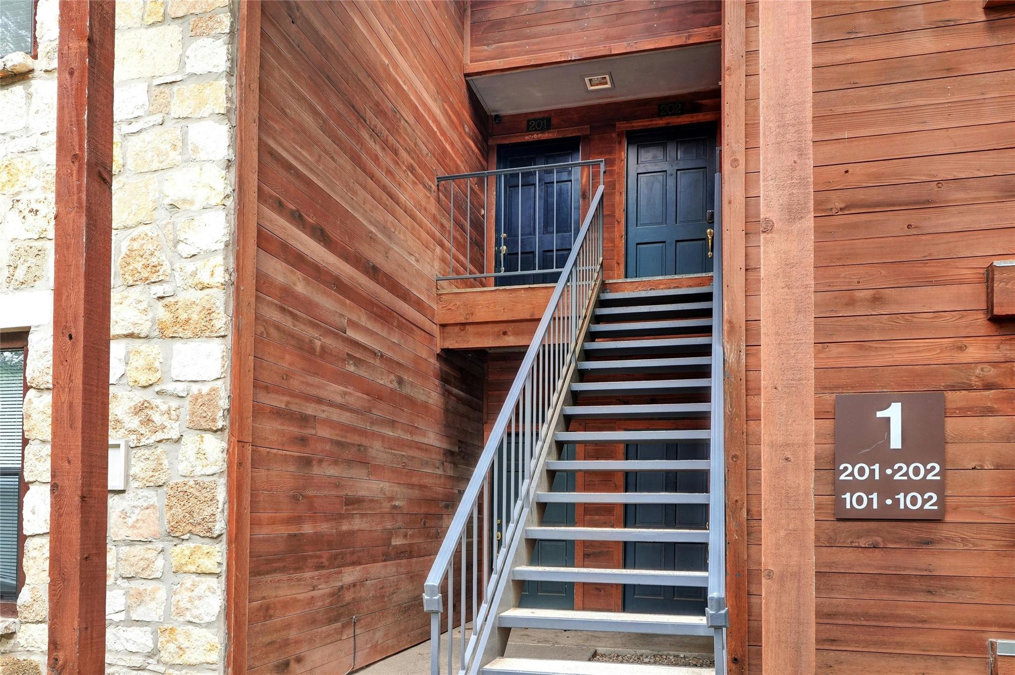 4711 Spicewood Springs Road, Unit 1201 Austin, TX 78759 - Photo 26 of 35 Upper-level entry with exterior stair access
