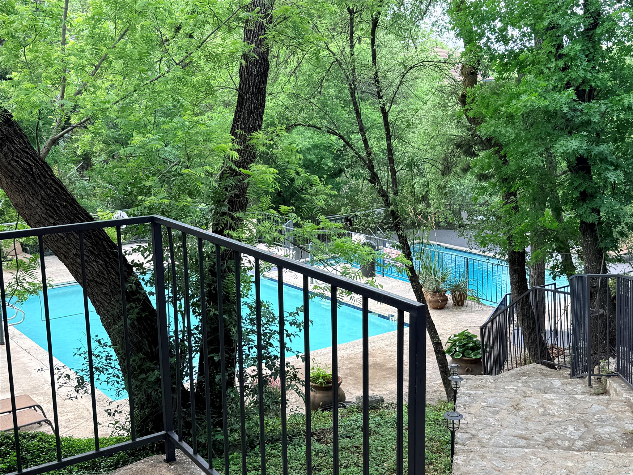 4711 Spicewood Springs Road, Unit 1201 Austin, TX 78759 - Photo 29 of 35 View of pool walking down the path