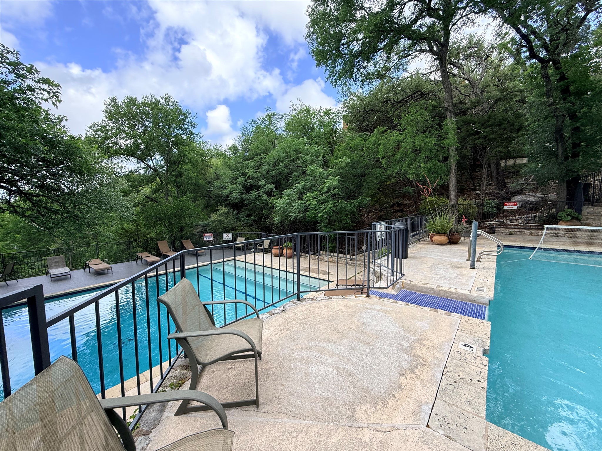 4711 Spicewood Springs Road, Unit 1201 Austin, TX 78759 - Photo 31 of 35 Resort-style pool area with a peaceful wooded setting