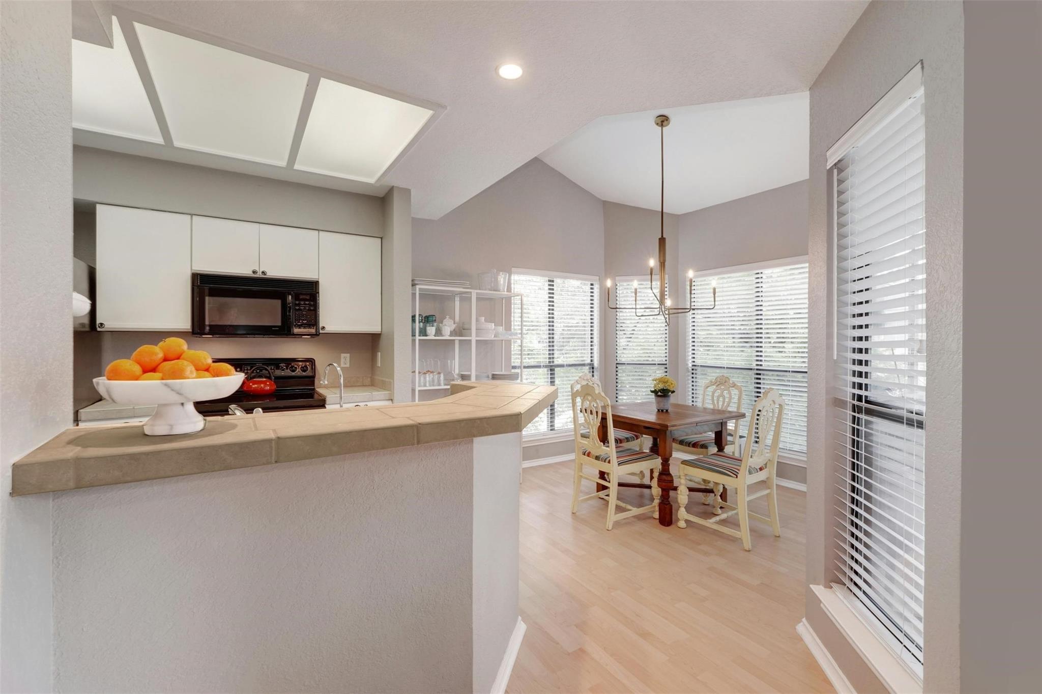 4711 Spicewood Springs Road, Unit 1201 Austin, TX 78759 - Photo 7 of 35 Dining area just off the kitchen with an open feel