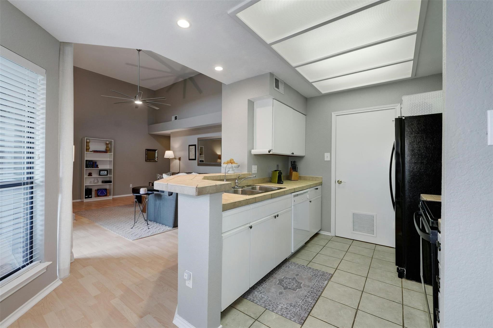 4711 Spicewood Springs Road, Unit 1201 Austin, TX 78759 - Photo 9 of 35 Bright kitchen with ample counter space and great flow