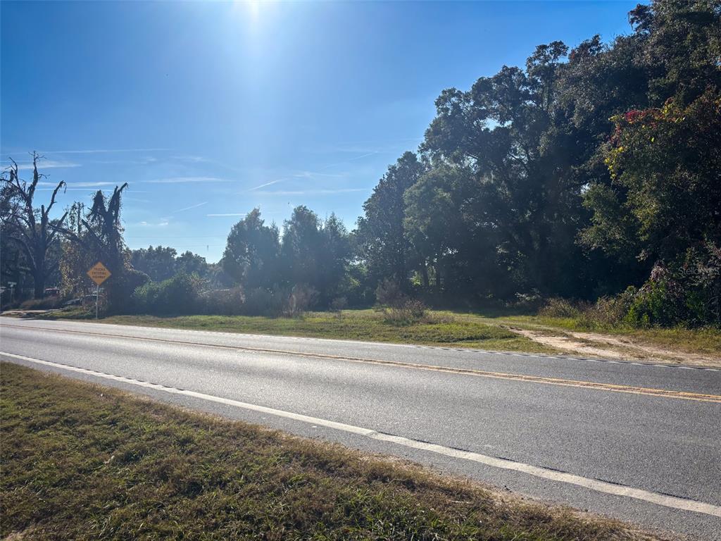 a view of a yard next to a lake