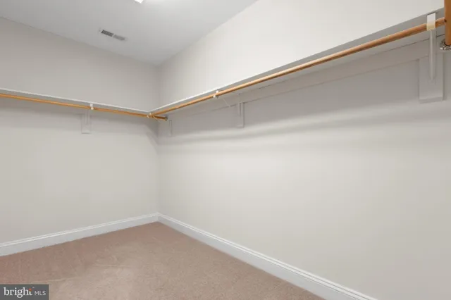 a view of a room with shelf on the wall