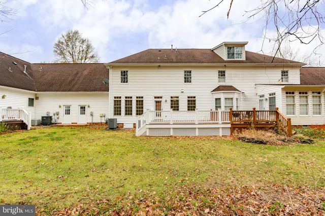 a view of a house with backyard porch and furniture