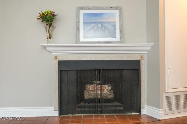 a view of fireplace and wooden floor