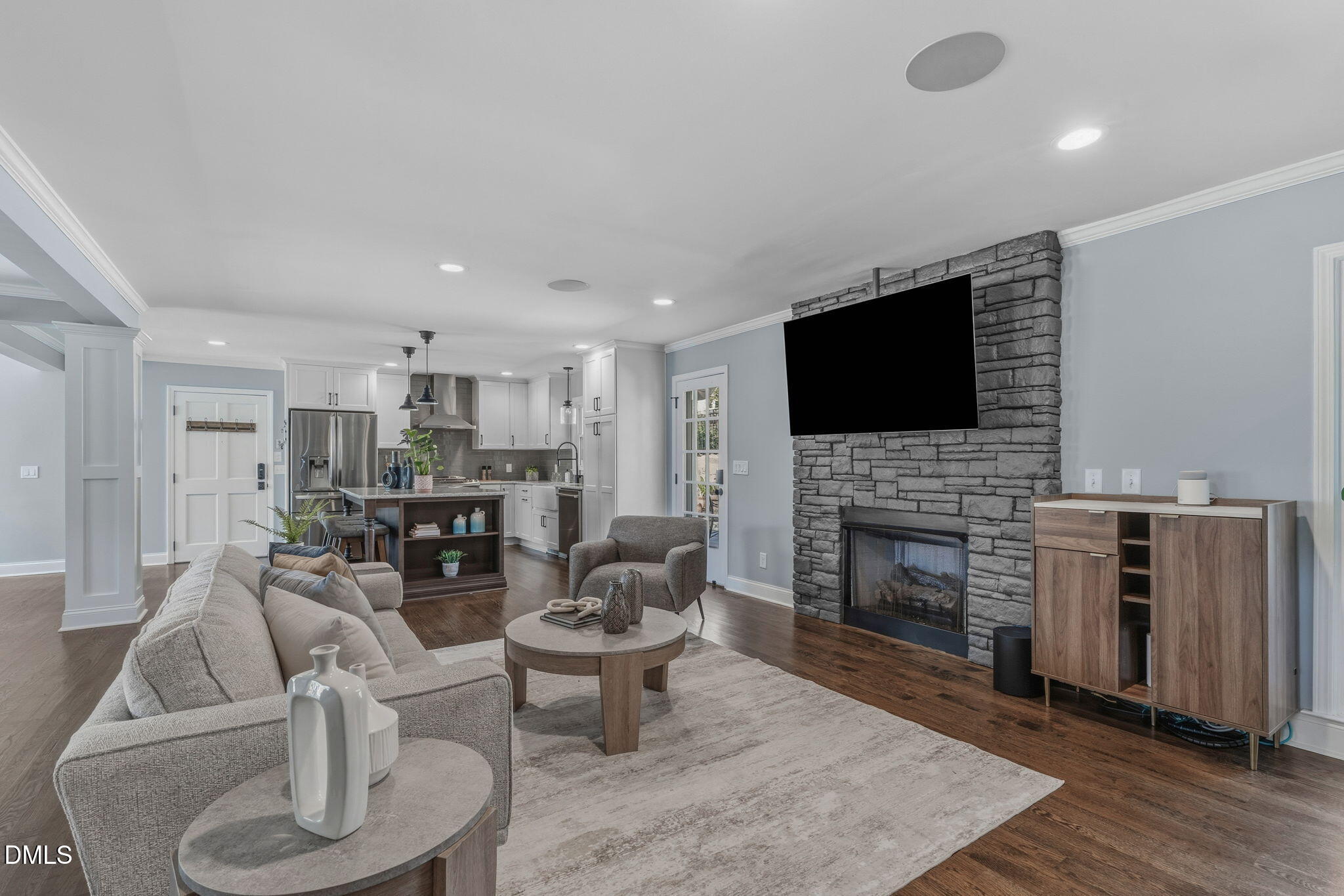 3016 Devonshire Drive Raleigh, NC 27607 - Photo 2 of 67 a living room with fireplace furniture and a flat screen tv