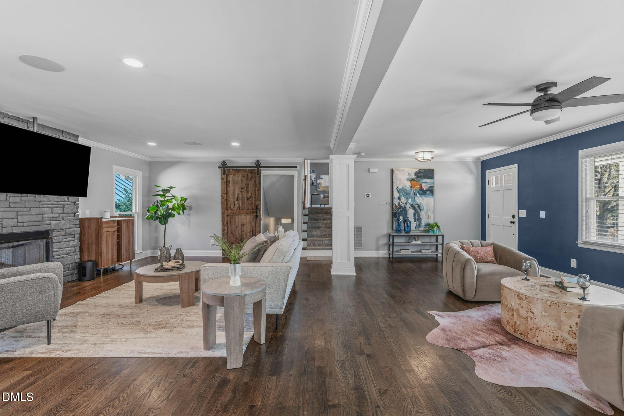 3016 Devonshire Drive Raleigh, NC 27607 - Photo 26 of 67 a living room with furniture a fireplace and a flat screen tv