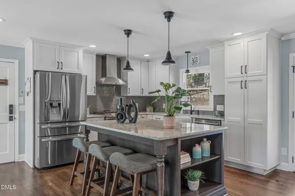 a view of swimming pool with outdoor seating