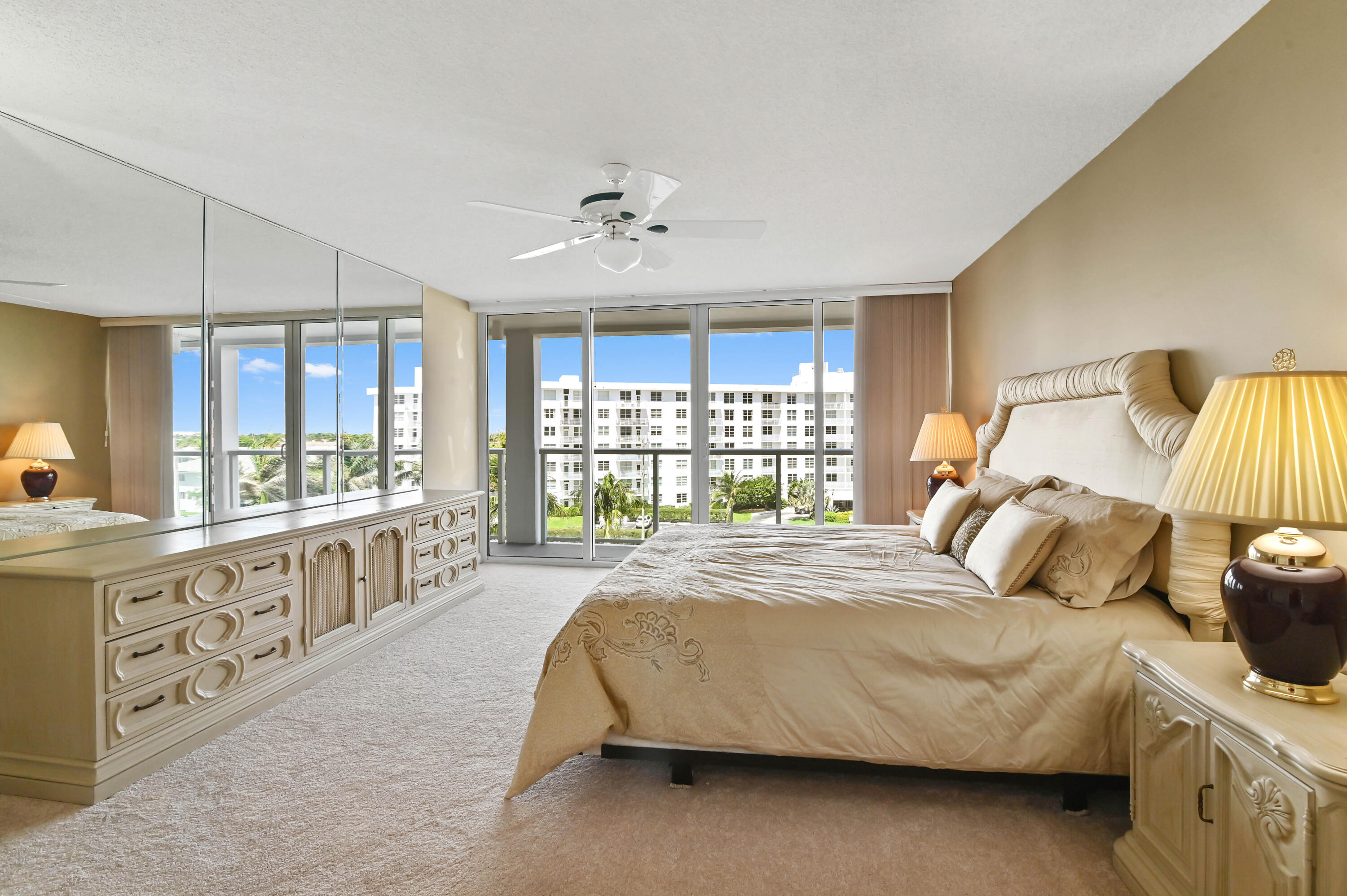 2800 South Ocean Boulevard, Unit 5J Boca Raton, FL 33432 - Photo 16 of 56 a bedroom with a large bed and a large window