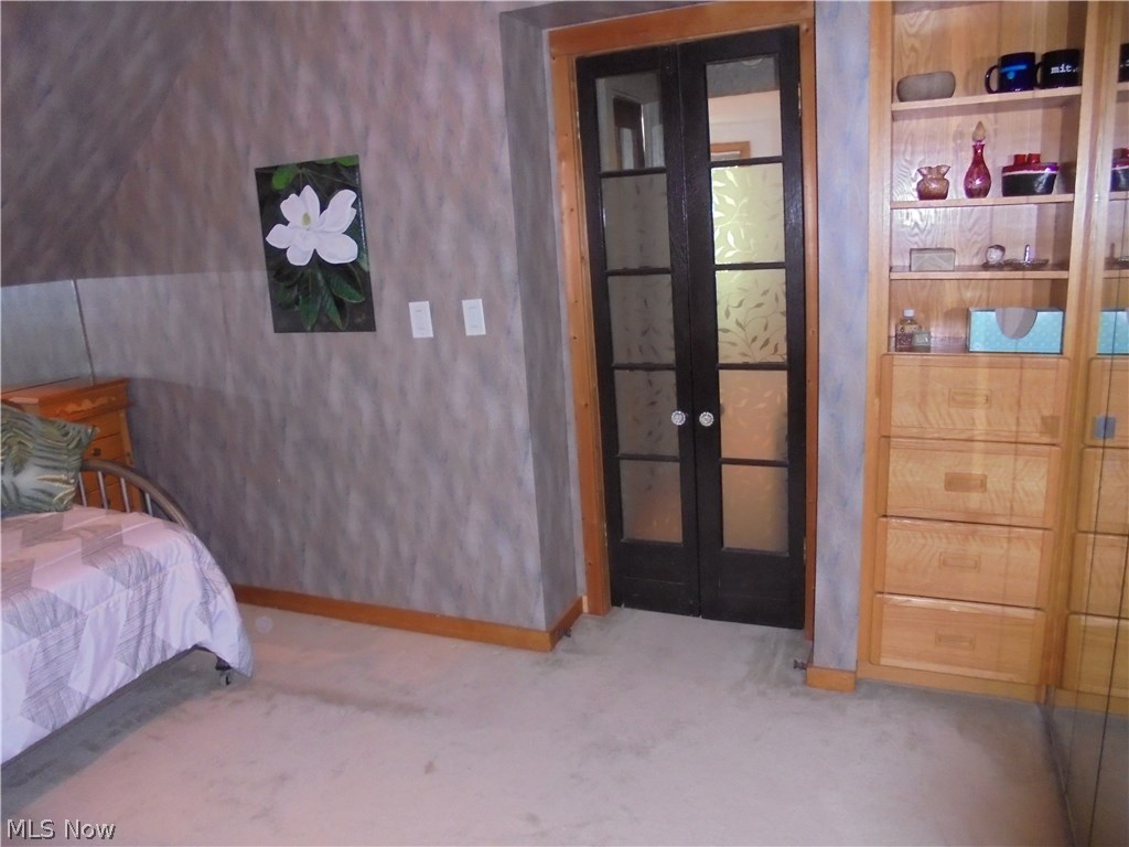 25014 Lake Road Bay Village, OH 44140 - Photo 12 of 35 Second bedroom has wallfull of mirrored doors closet plus additional built-ins.