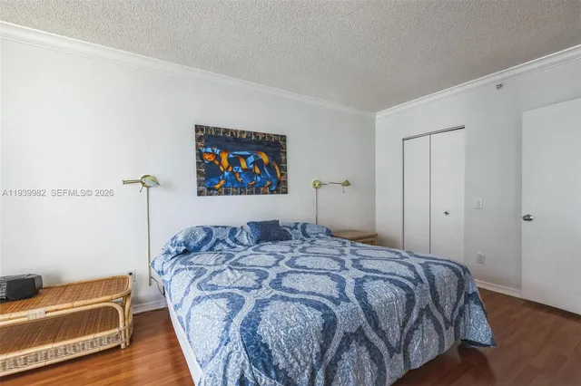 a bedroom with a bed and a cabinets