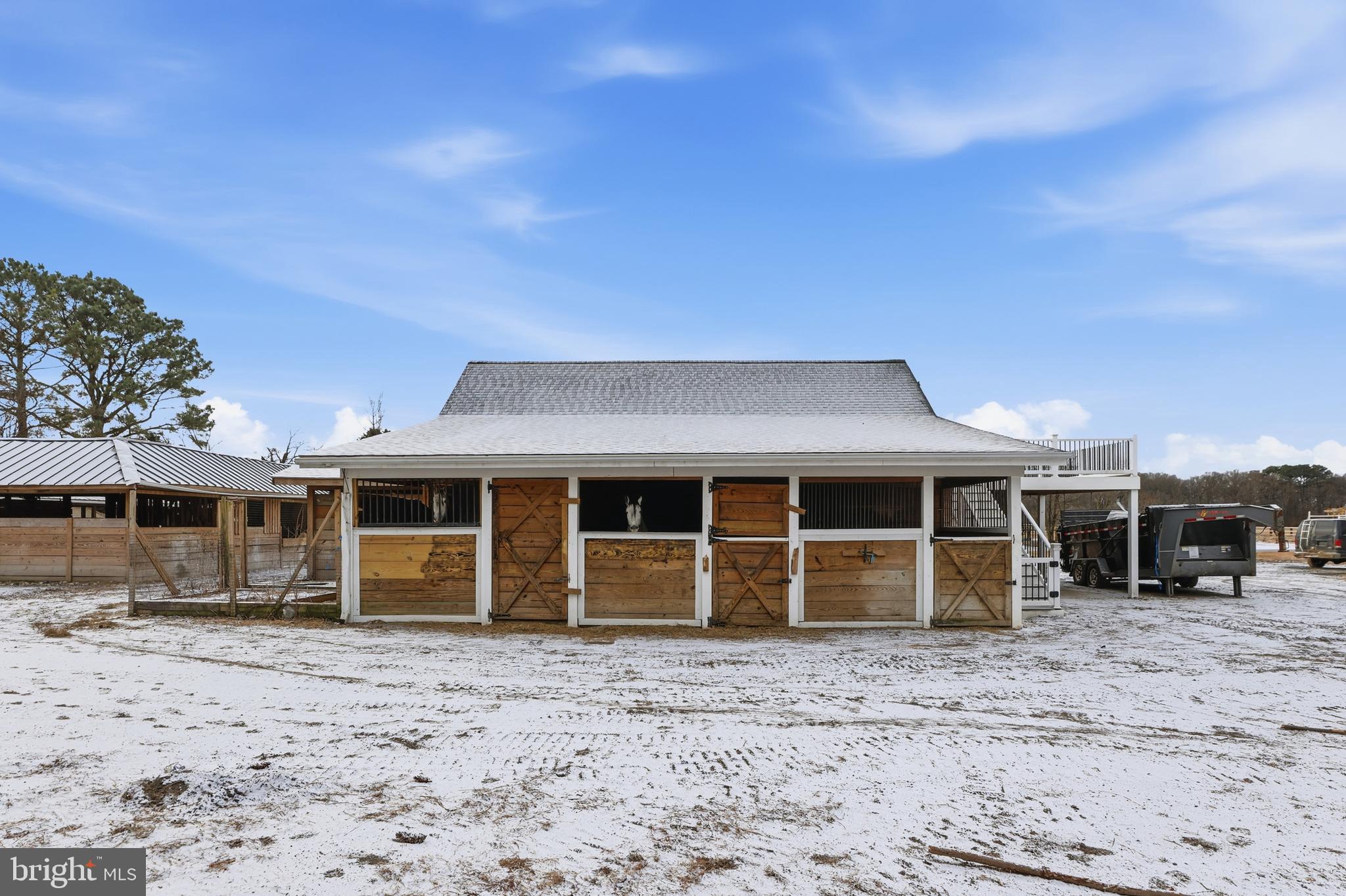 20915 Dover Bridge Road Preston, MD 21655 - Photo 47 of 60 a front view of a house with a yard and seating area