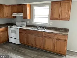 a kitchen with sink cabinets and window