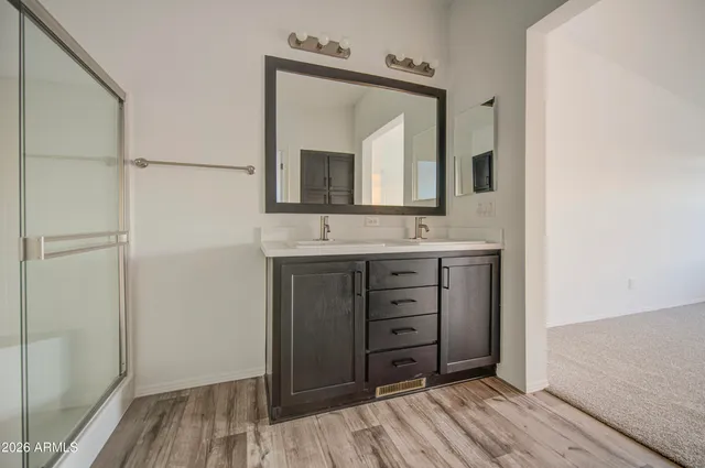 a bathroom with a vanity and a mirror