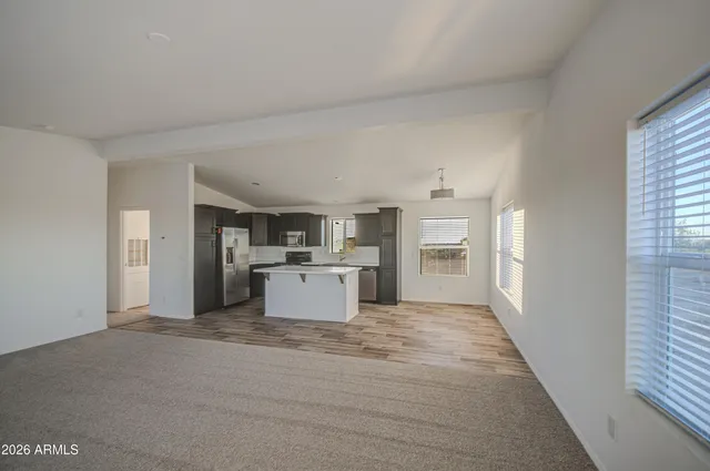 a view of a kitchen with a sink and dishwasher cabinets