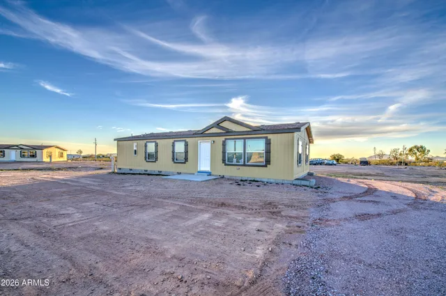 a view of a backyard of the house