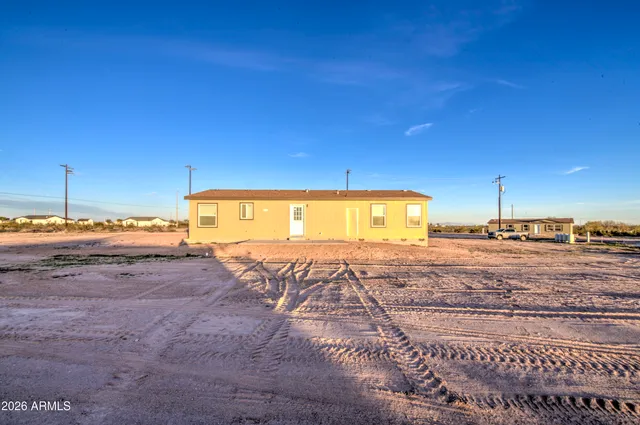 a view of a backyard of the house