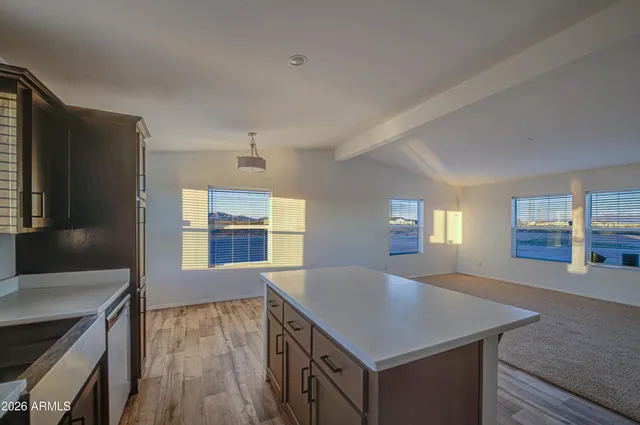 a kitchen with a stove and a refrigerator