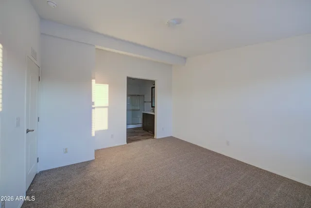 a view of an empty room with a window