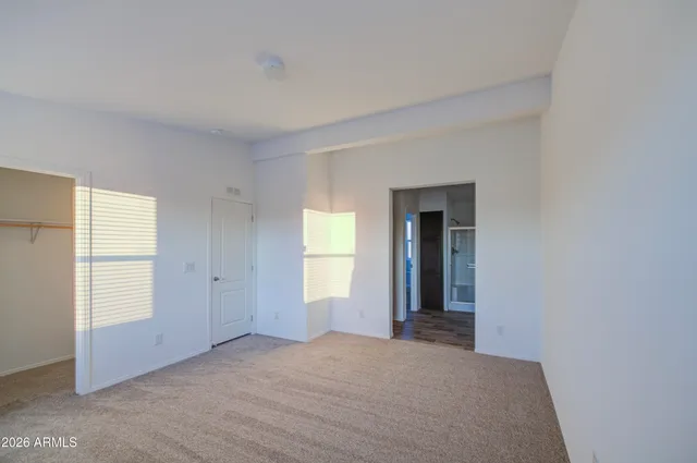 a view of a room that has a window in it