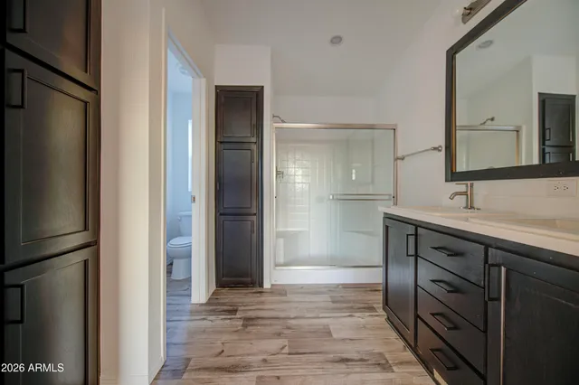 a spacious bathroom with a sink and a mirror