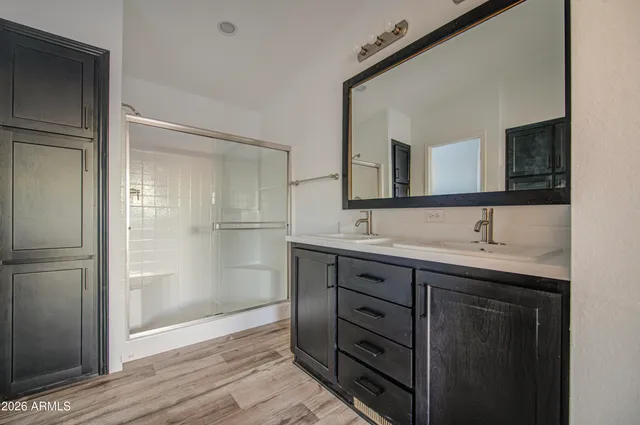 a bathroom with a sink and a mirror