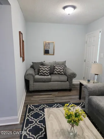 a kitchen with stainless steel appliances granite countertop a refrigerator stove top oven and sink