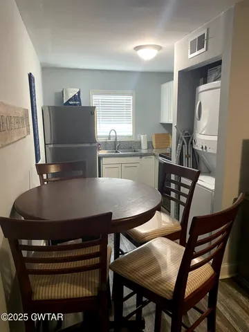 a bedroom with a bed and a night stand