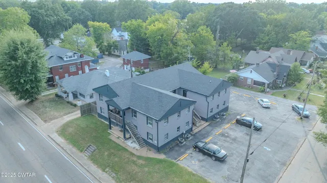 an aerial view of a house with outdoor space