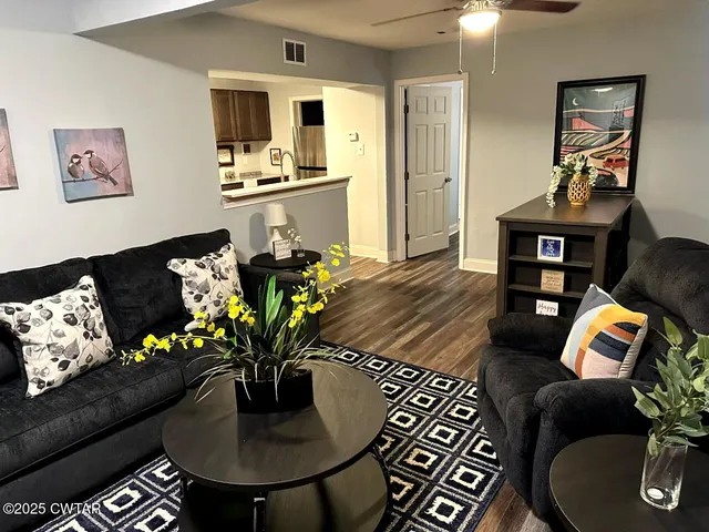 a kitchen with stainless steel appliances a stove a sink and a microwave