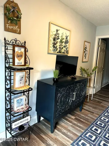 a large bed in a bedroom next to a window