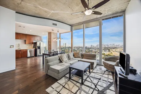 a living room with fireplace furniture and a flat screen tv