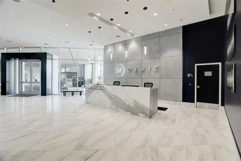 a large white bathroom with a large tub