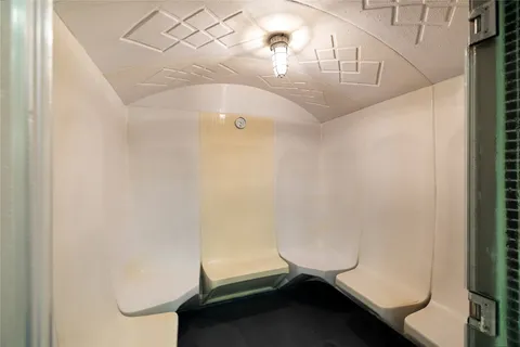 a view of swimming pool with a patio and plants