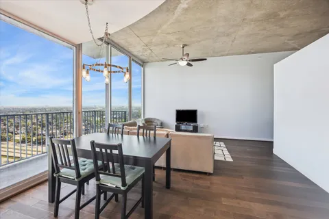 a view of a dining room with furniture window and outside view