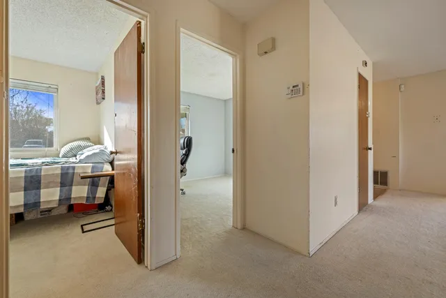 a workspace with furniture and a gate