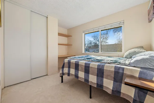 a bathroom with a granite countertop toilet a sink and a bathtub