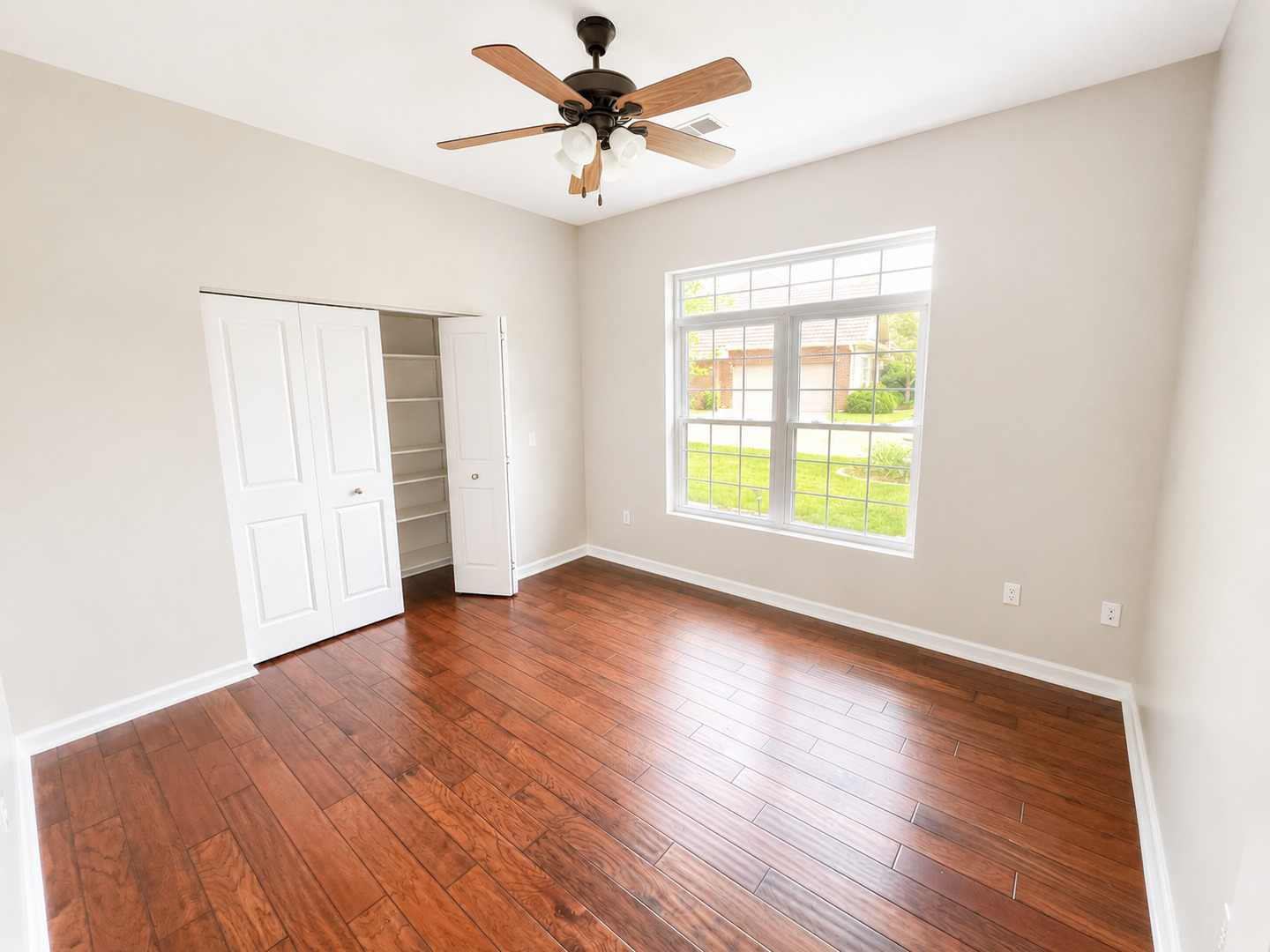 1002 2nd St Court Moline, IL 61265 - Photo 20 of 31 a view of an empty room with window and wooden floor