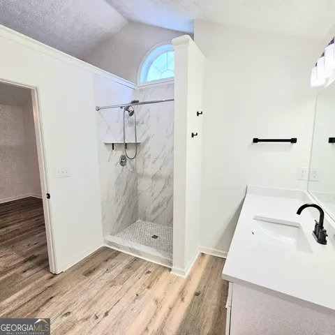 a bathroom with a bathtub and toilet