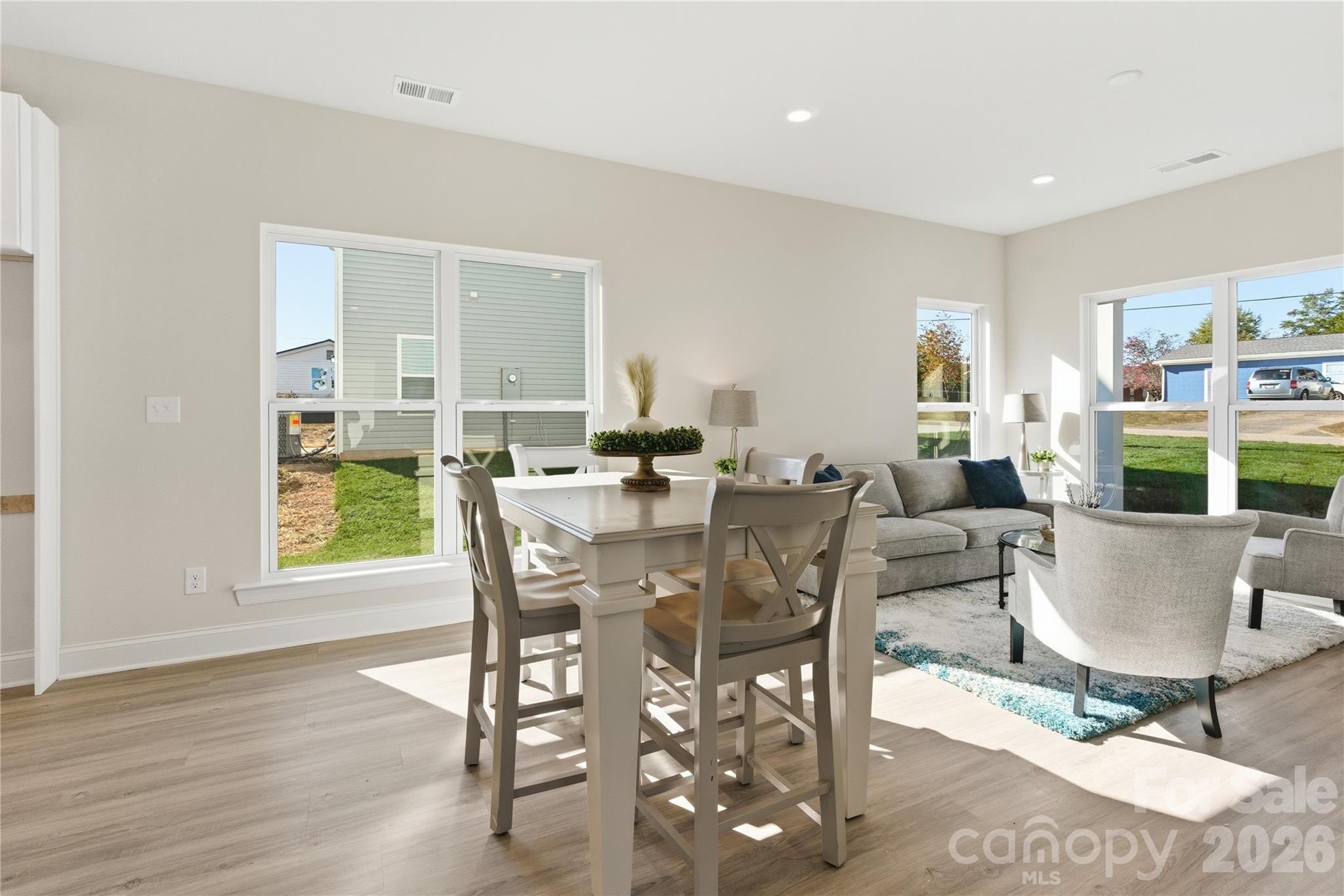 222 1st Street South Fort Mill, SC 29708 - Photo 6 of 23 a view of a dining room with furniture window and wooden floor
