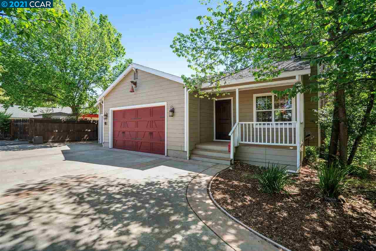 3168 Cowell Road Concord, CA 94518 - Photo 1 of 1 a front view of a house with a yard and garage
