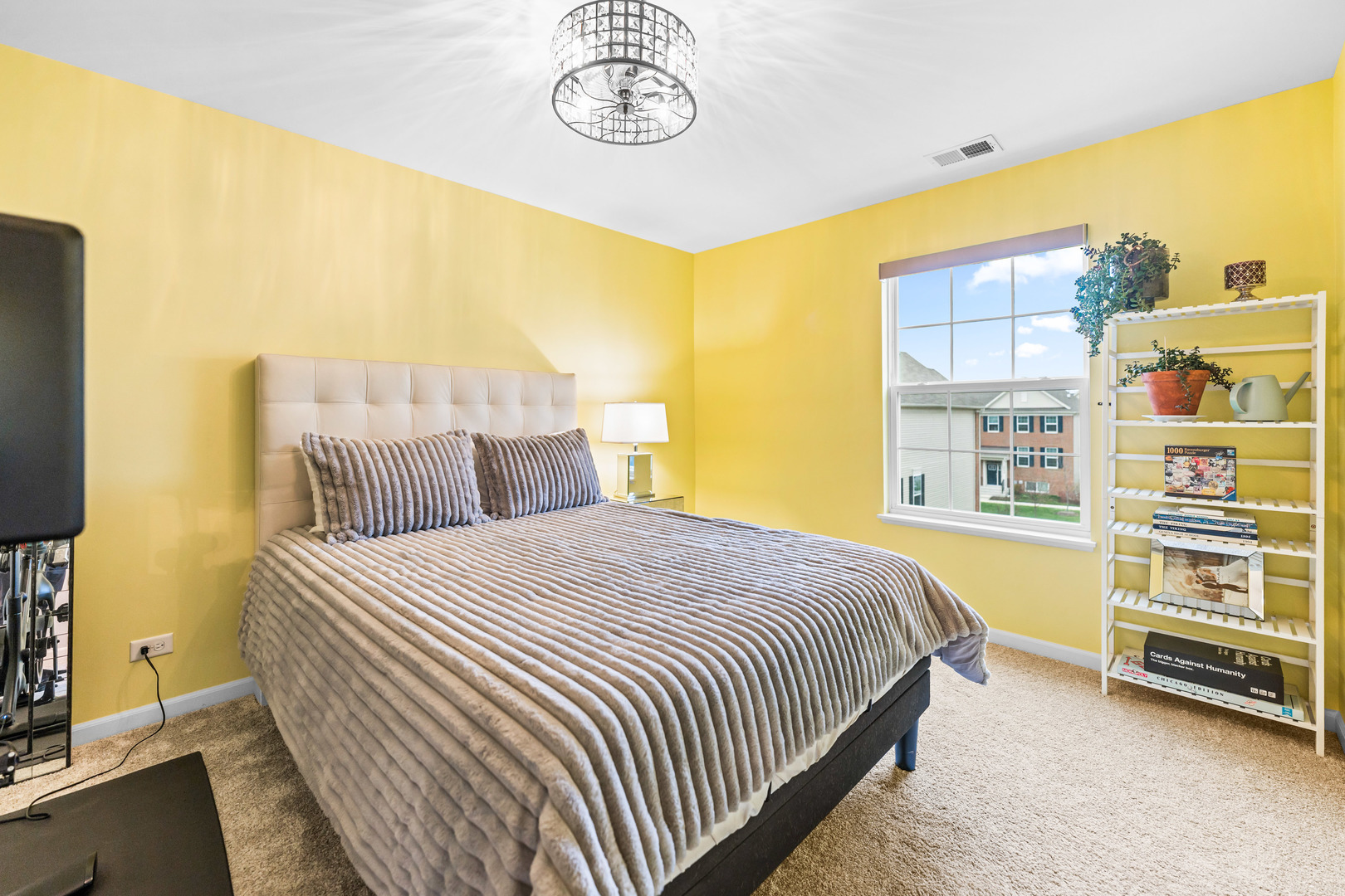 1627 Sager Way Batavia, IL 60510 - Photo 22 of 30 a bedroom with a bed and a television