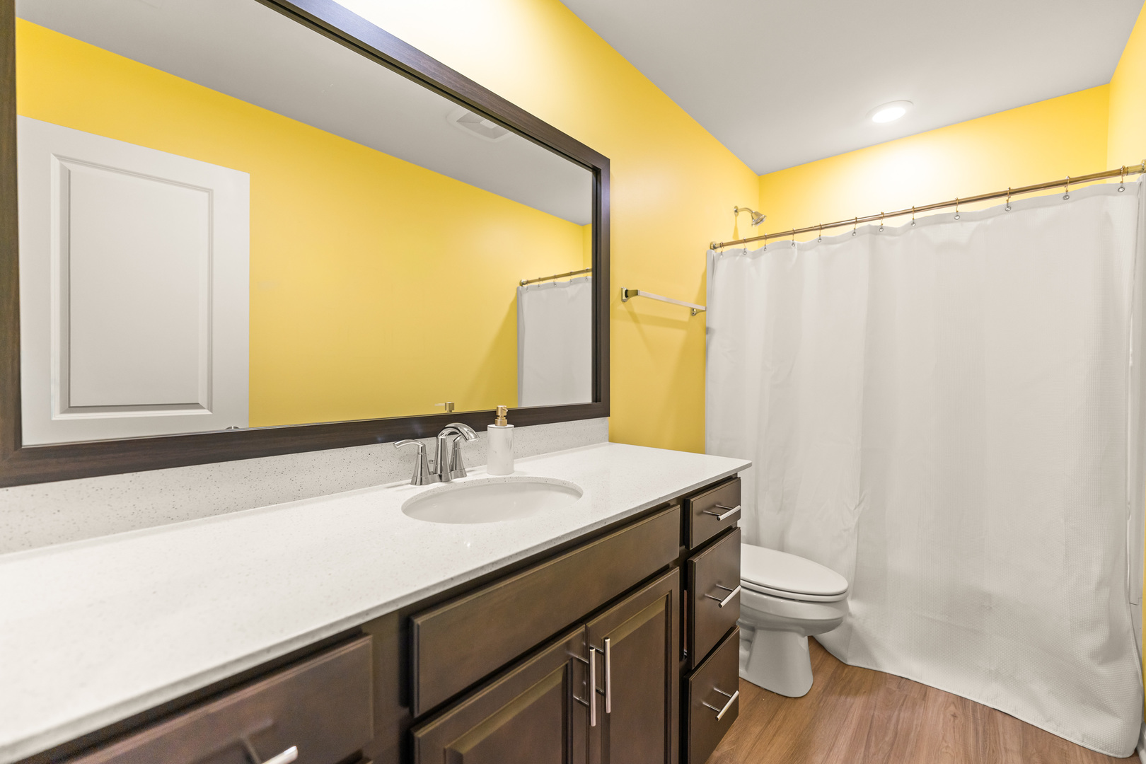 1627 Sager Way Batavia, IL 60510 - Photo 24 of 30 a bathroom with a sink a toilet and a mirror