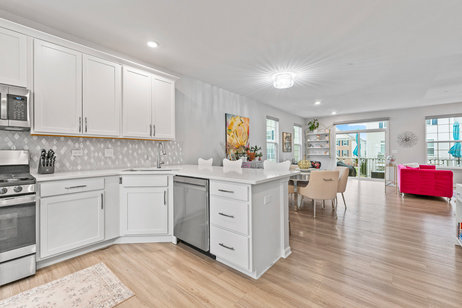 1627 Sager Way Batavia, IL 60510 - Photo 7 of 30 a kitchen with white cabinets and sink