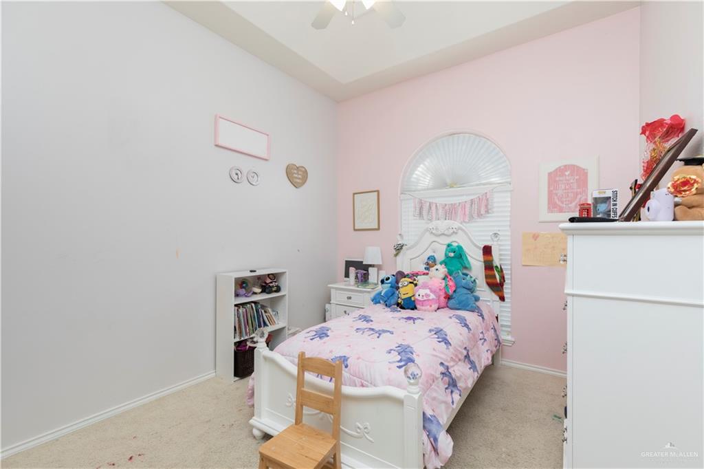 1801 Largo Street Weslaco, TX 78596 - Photo 12 of 20 a bedroom with a bed and wooden floor