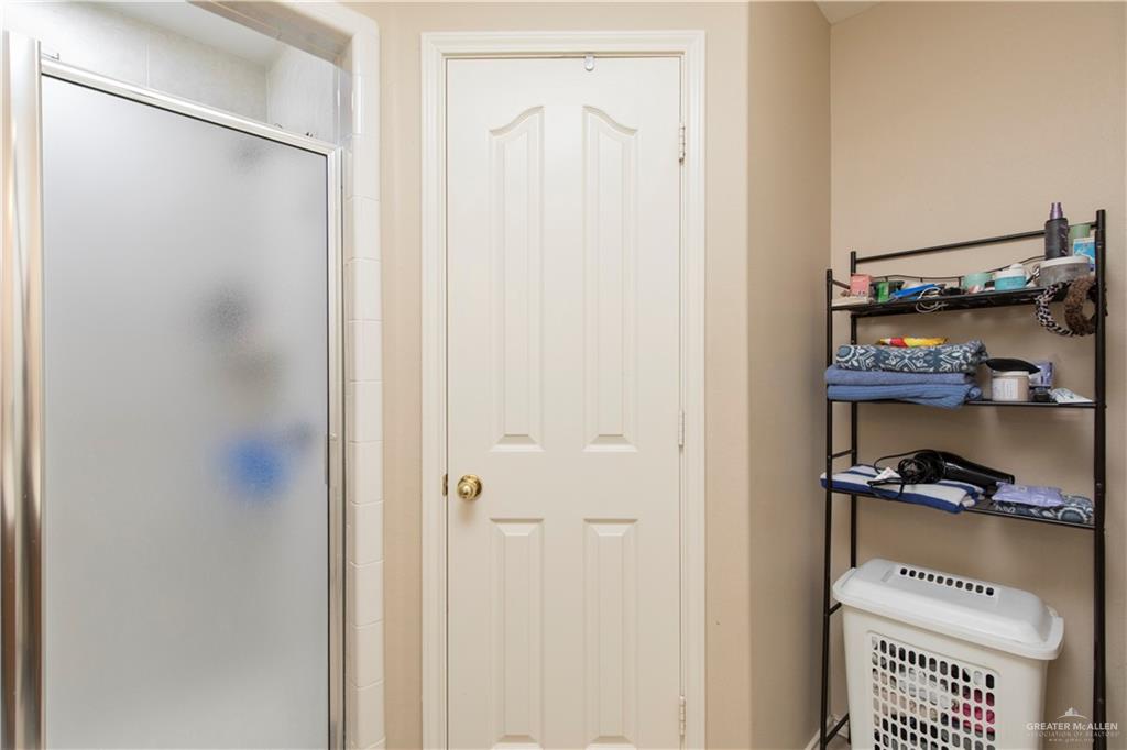 1801 Largo Street Weslaco, TX 78596 - Photo 14 of 20 a view of walk in closet with clothes and shoes