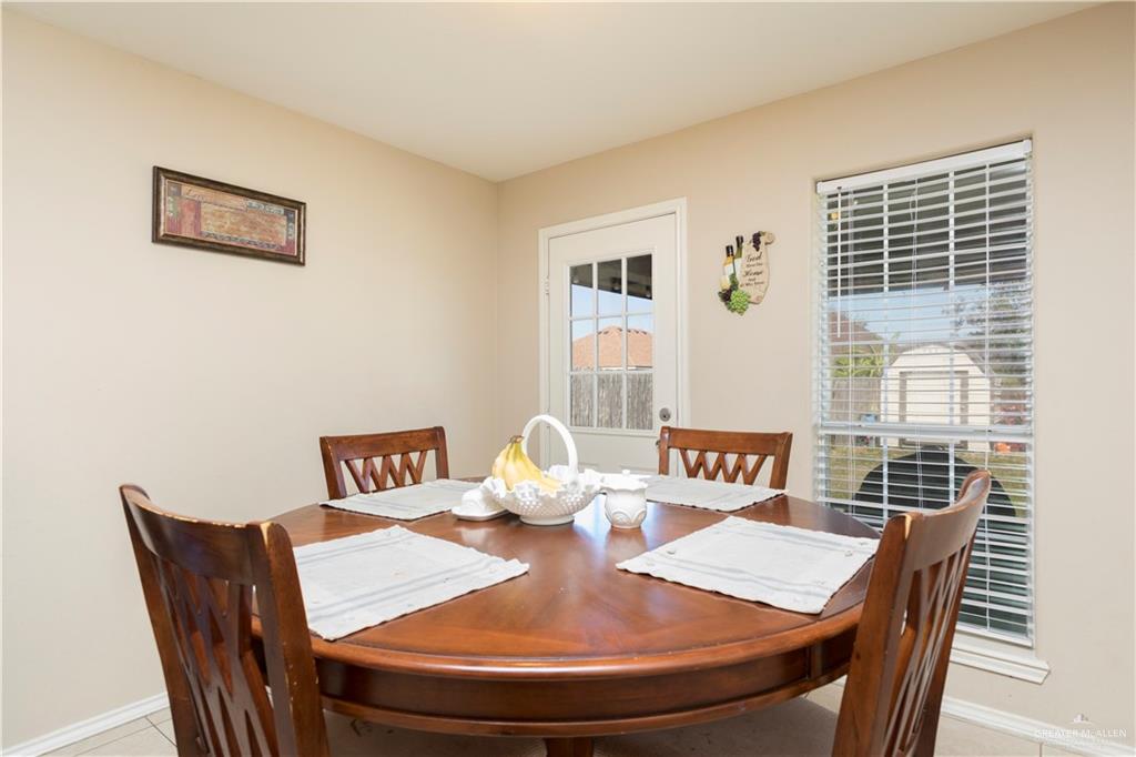 1801 Largo Street Weslaco, TX 78596 - Photo 16 of 20 a view of a dining room with furniture