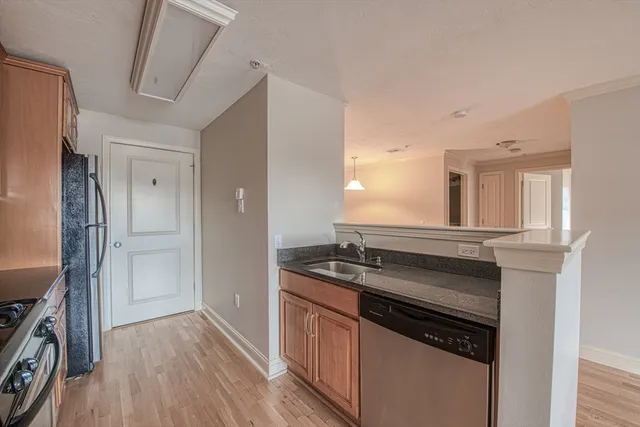 a kitchen with a stove and a refrigerator